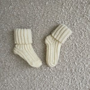 Cream colored tiny newborn socks